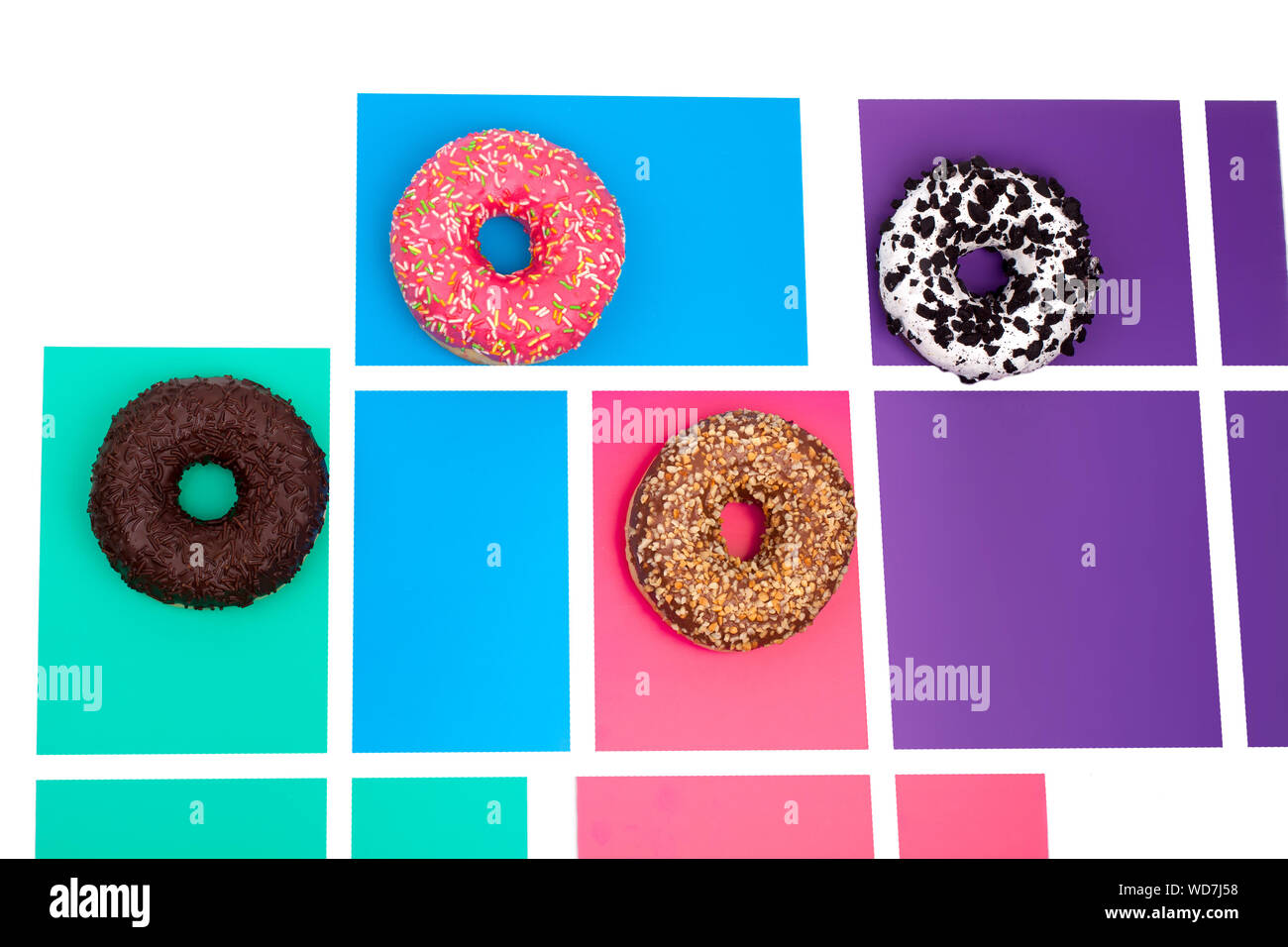 Different donuts on a bright colored background top view close up Stock ...