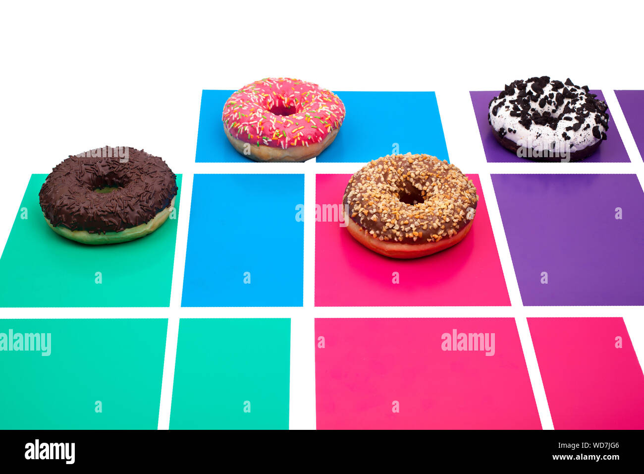 Different donuts on a bright colored background top view close up Stock ...