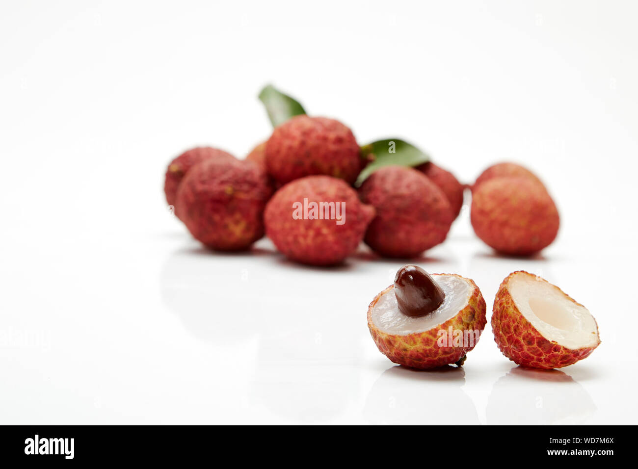 Close-up Of Lychee Against White Background Stock Photo