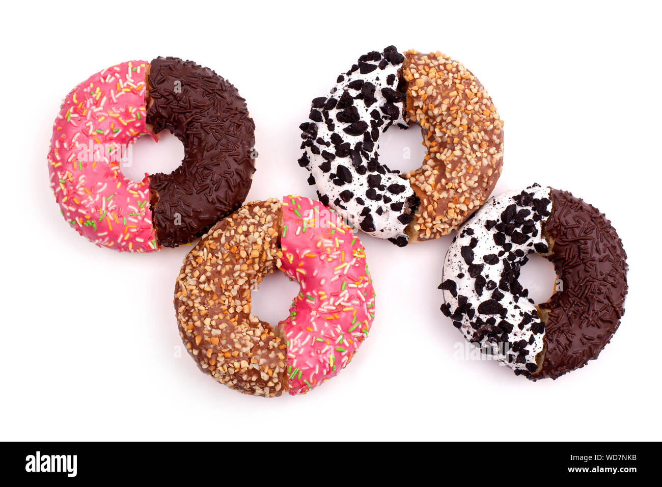 Different donuts halves mixed on a white background top view close up Stock Photo