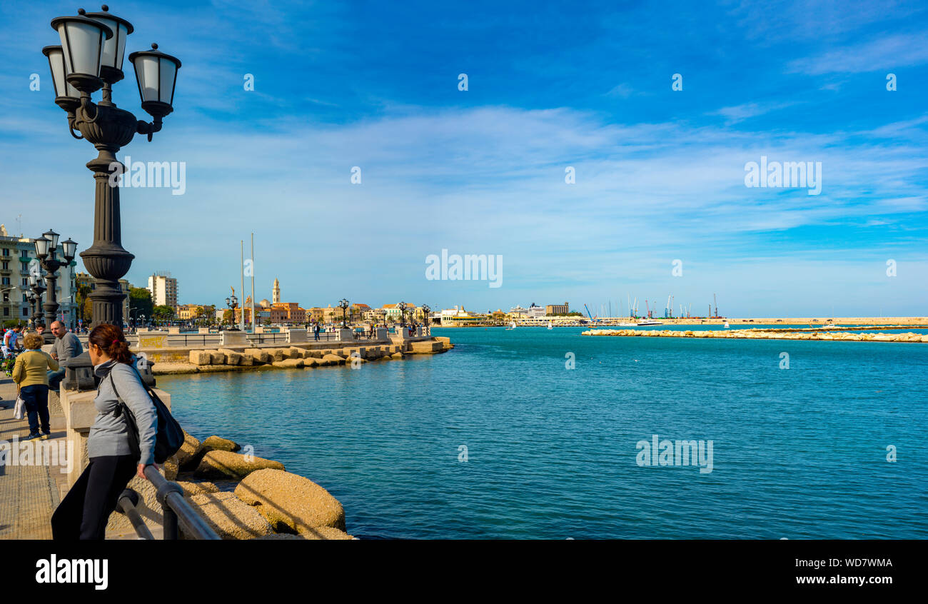 Bari, Italy - October 10, 2017: foreground the characteristic lamp post and in the background on the seafront Bari, Apulia Stock Photo