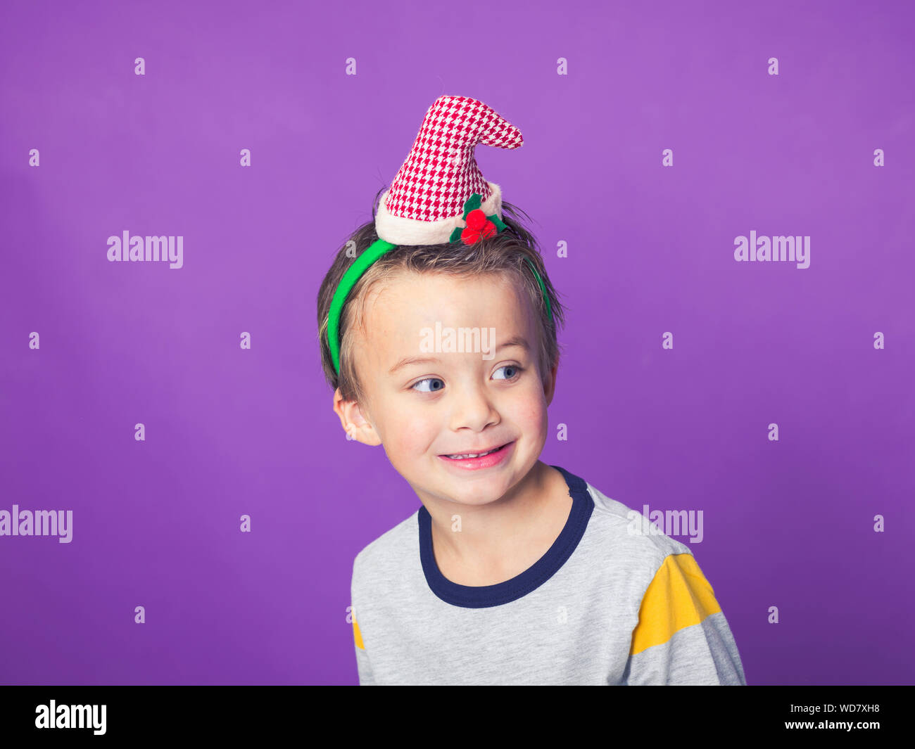 Boy wearing party hat hires stock photography and images Alamy