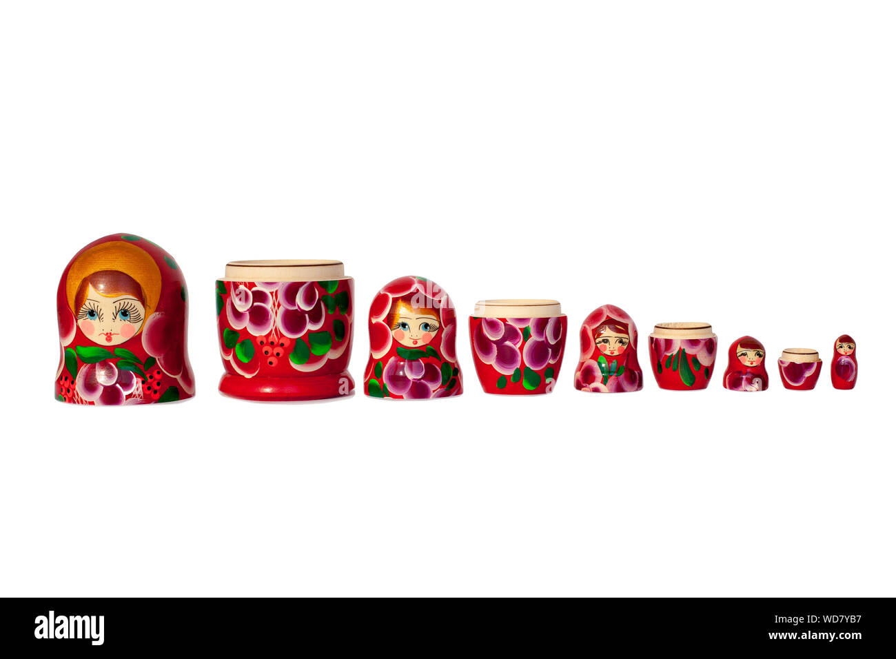Matryoshka Russian nesting doll souvenir in group bright red on white