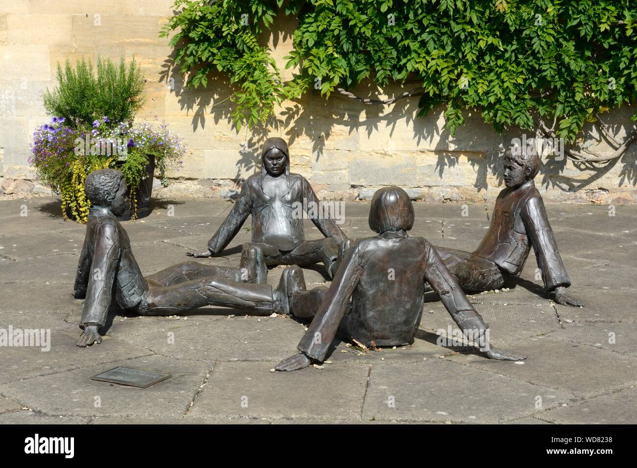 Touching Souls bronze sculpture in the garden of Tewkesbury Abbey