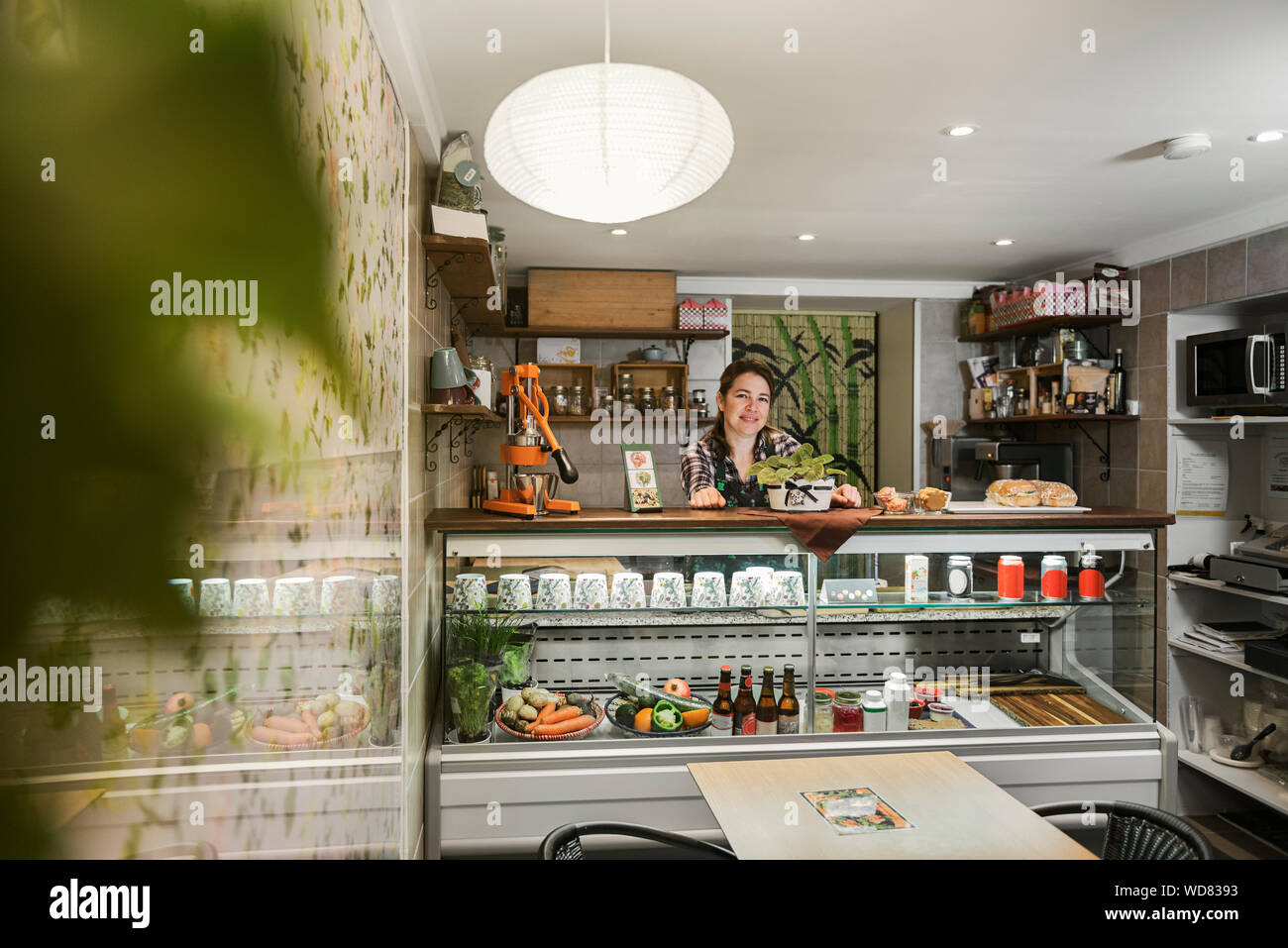 Cafe Owner Behind Counter Stock Photo Alamy