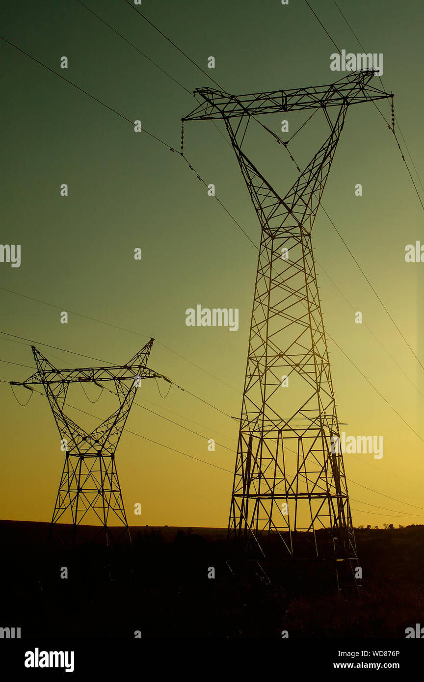 Electrical Pylons at sunset Stock Photo