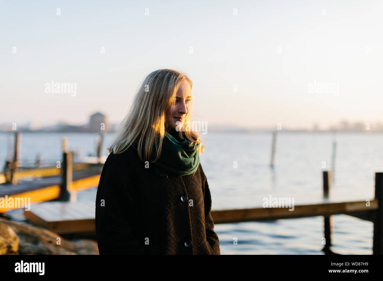 Woman wearing coat hi-res stock photography and images - Alamy