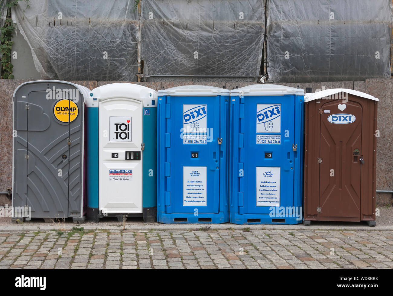 Various mobile toilets at a construction site Stock Photo
