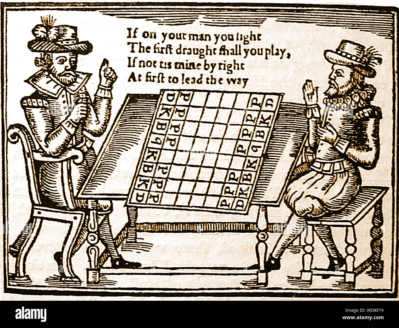 An historic early woodcut engraving showing two men playing draughts in a tavern in the 16th / 17th century Stock Photo