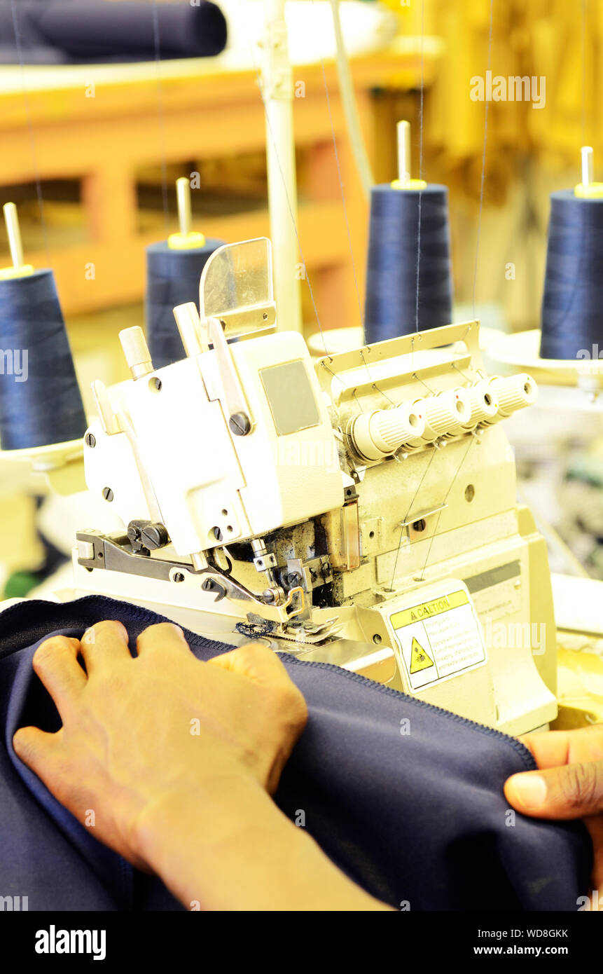 Employee working on an industrial sewing machine Stock Photo Alamy