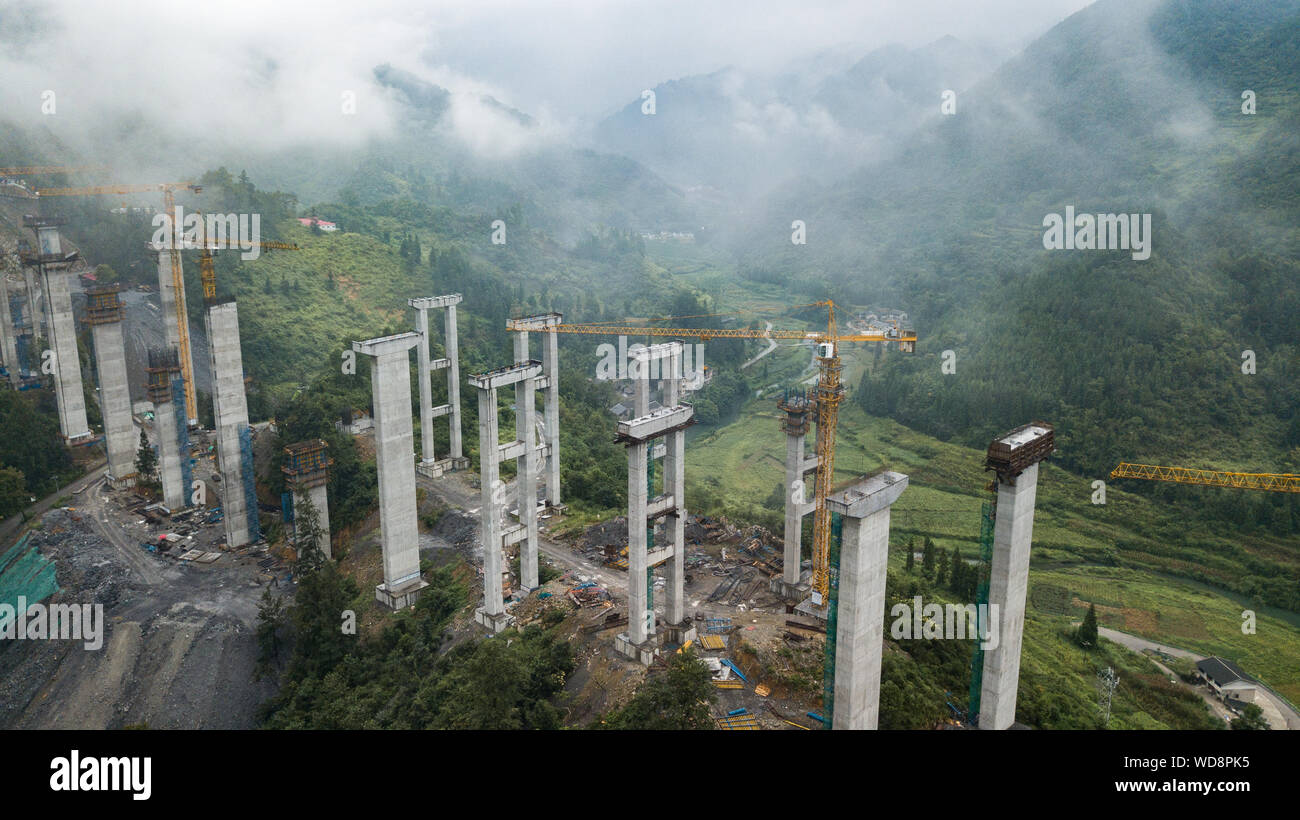 Zunyi. 28th Aug, 2019. Aerial photo taken on Aug. 28, 2019 shows the construction site of Weijiazhai grand bridge of the Lanzhou-Haikou expressway in southwest China's Guizhou Province. The Guizhou section of the Lanzhou-Haikou expressway is expected to open to traffic in 2022. Credit: Tao Liang/Xinhua/Alamy Live News Stock Photo