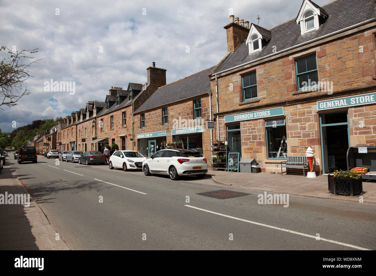 Castle Street and the General Store at Dornoch, a town in Sutherland, Highland, on the north east coast of Scotland Stock Photo