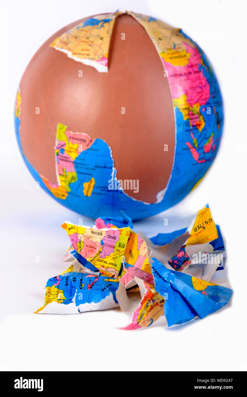 Broken World Globe torn into pieces Stock Photo