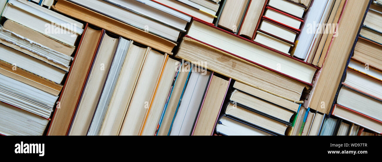 Books stack texture and background Stock Photo - Alamy