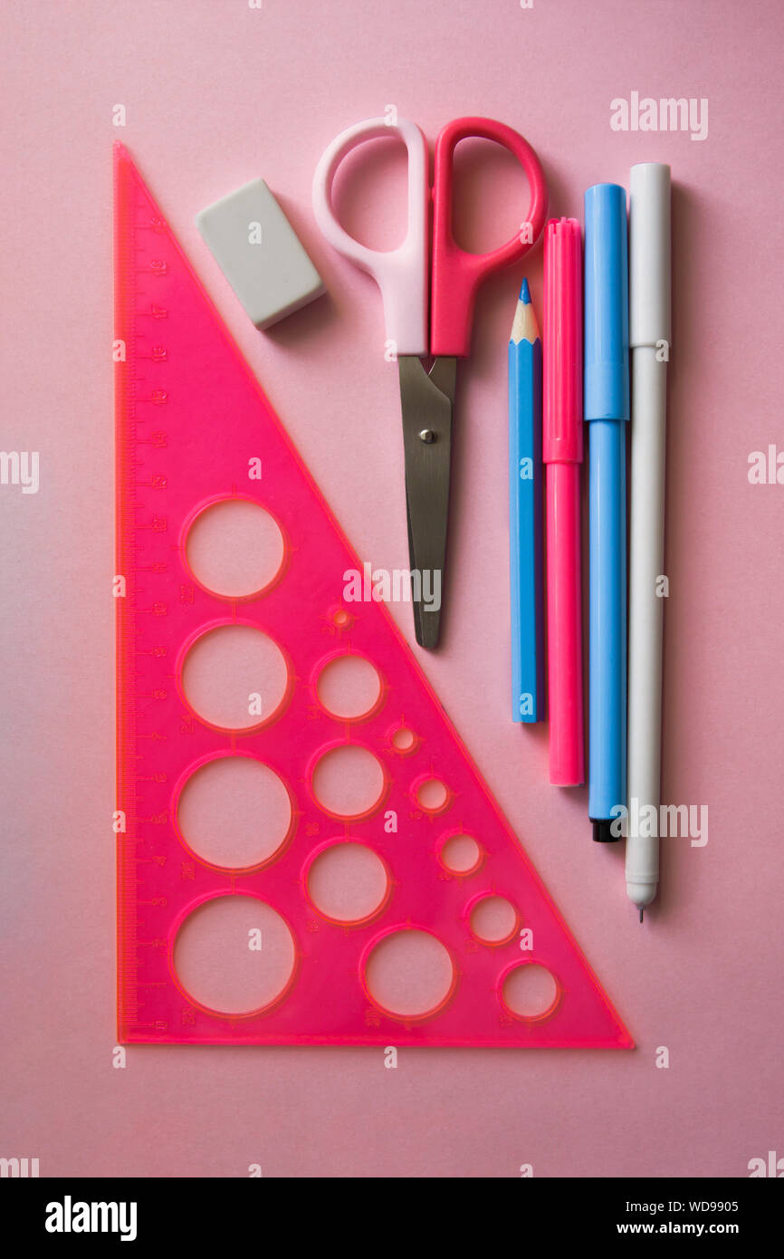 Various stationery on a trendy pink background. Back to school concept ...