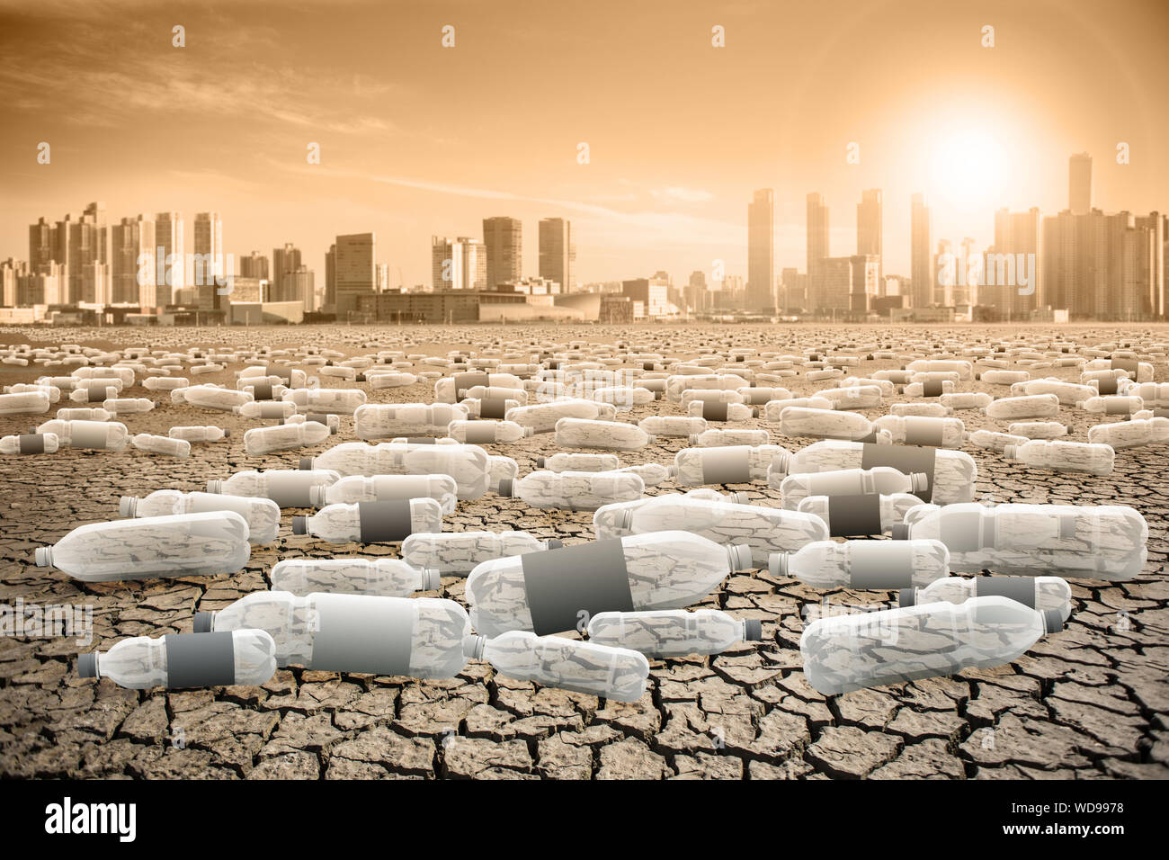 Plastic bottles in the desert. Post-apocalyptic landscape. Planet after the effects of plastic waste. Stock Photo