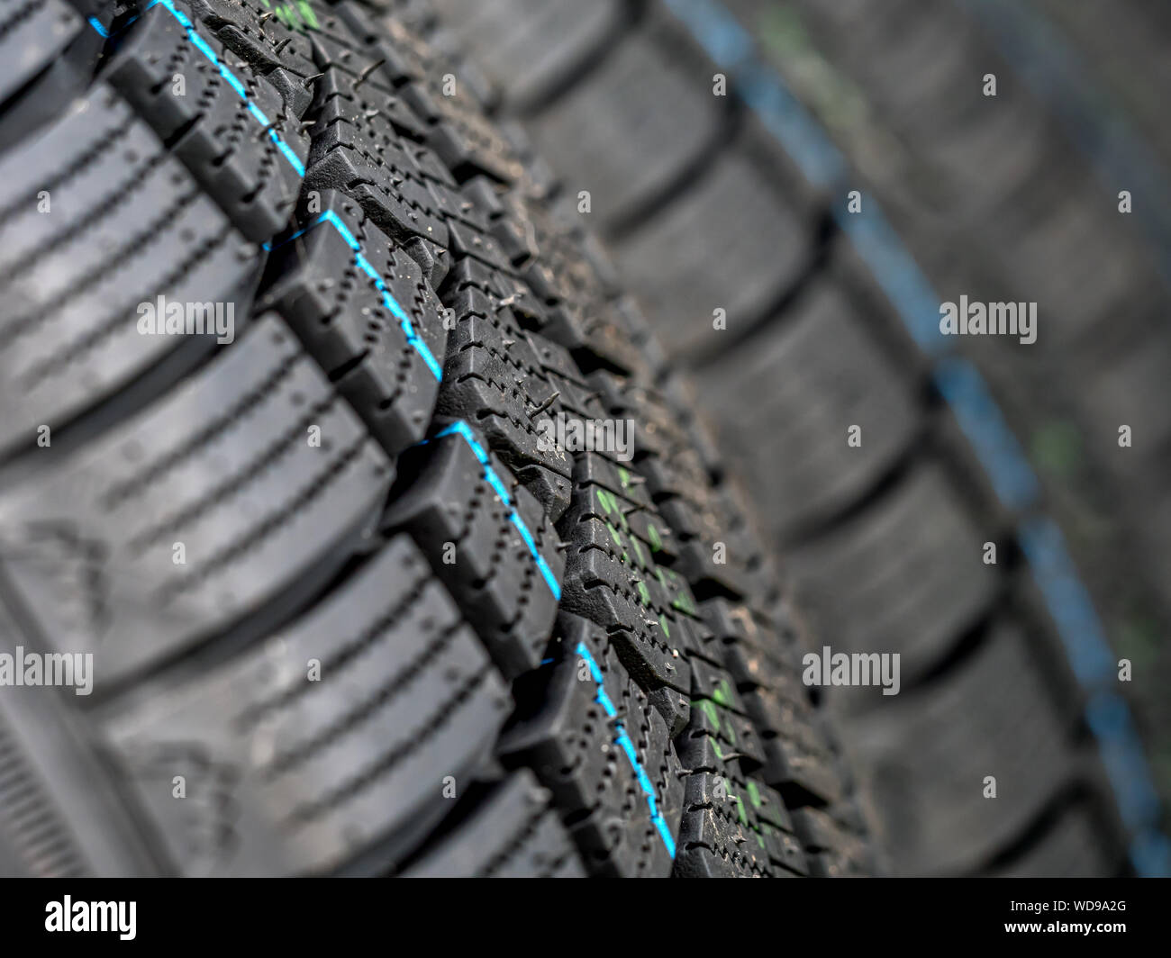 Closeup of row of new winter car tires Stock Photo