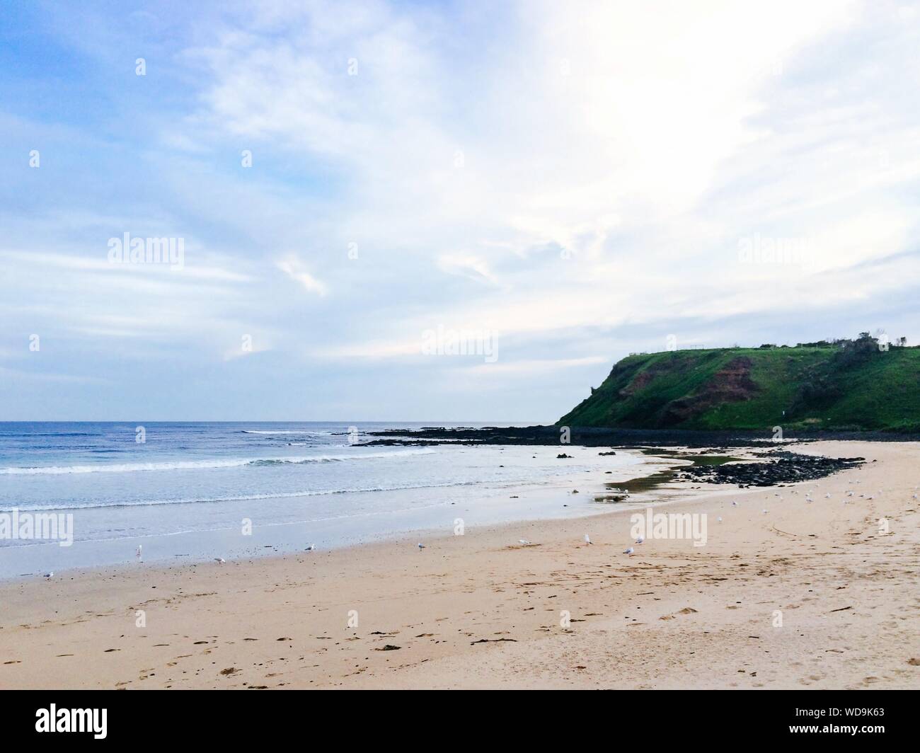 Scenic View Of Beach At Phillip Island Against Sky Stock Photo