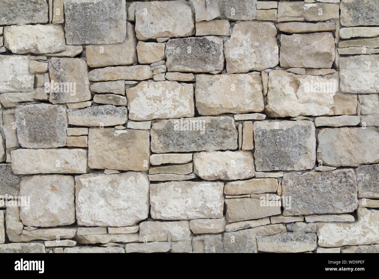 Dry stone wall as seamless background Stock Photo