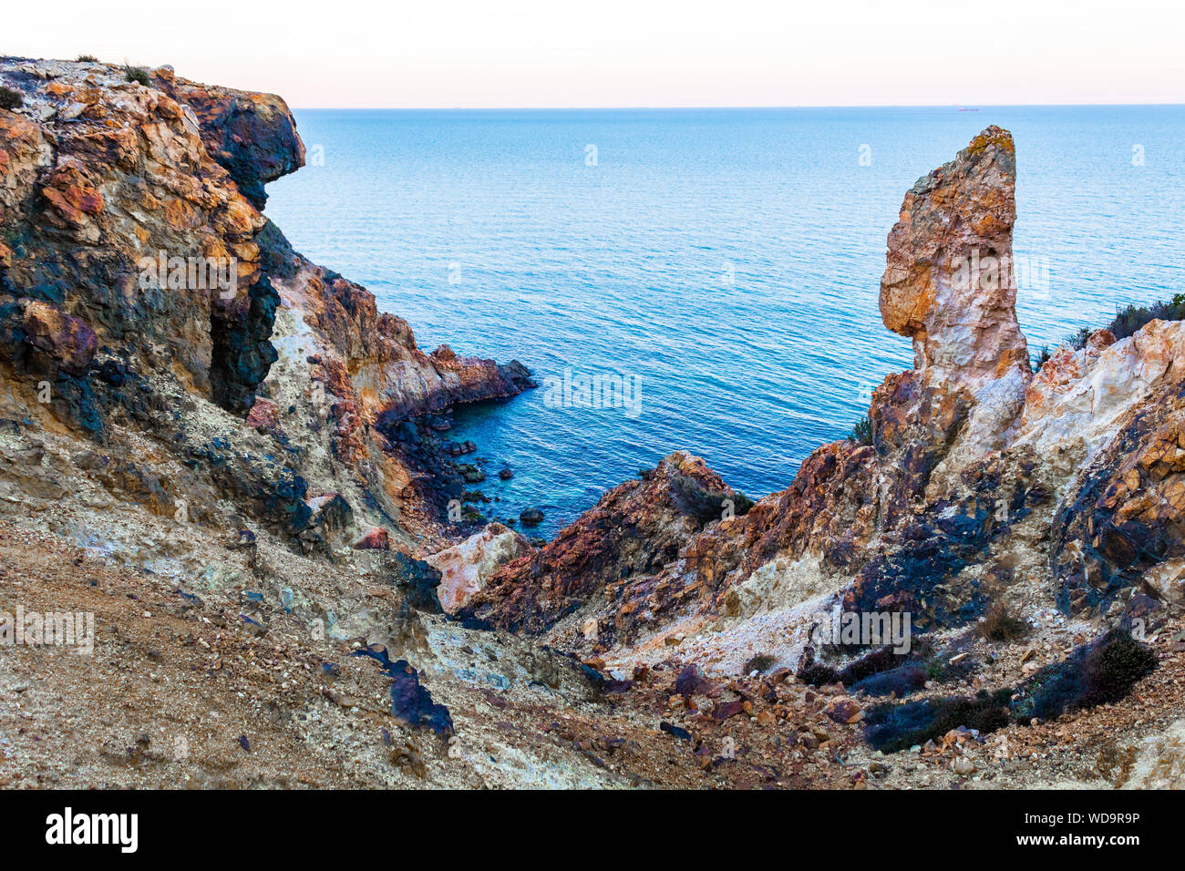 Exotic cliff rock, background sea Stock Photo