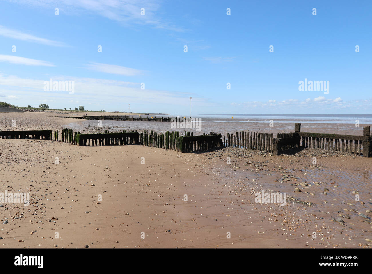 Heacham north on a sunny day with blue clear skies. Shoreline and beach in view. Stock Photo