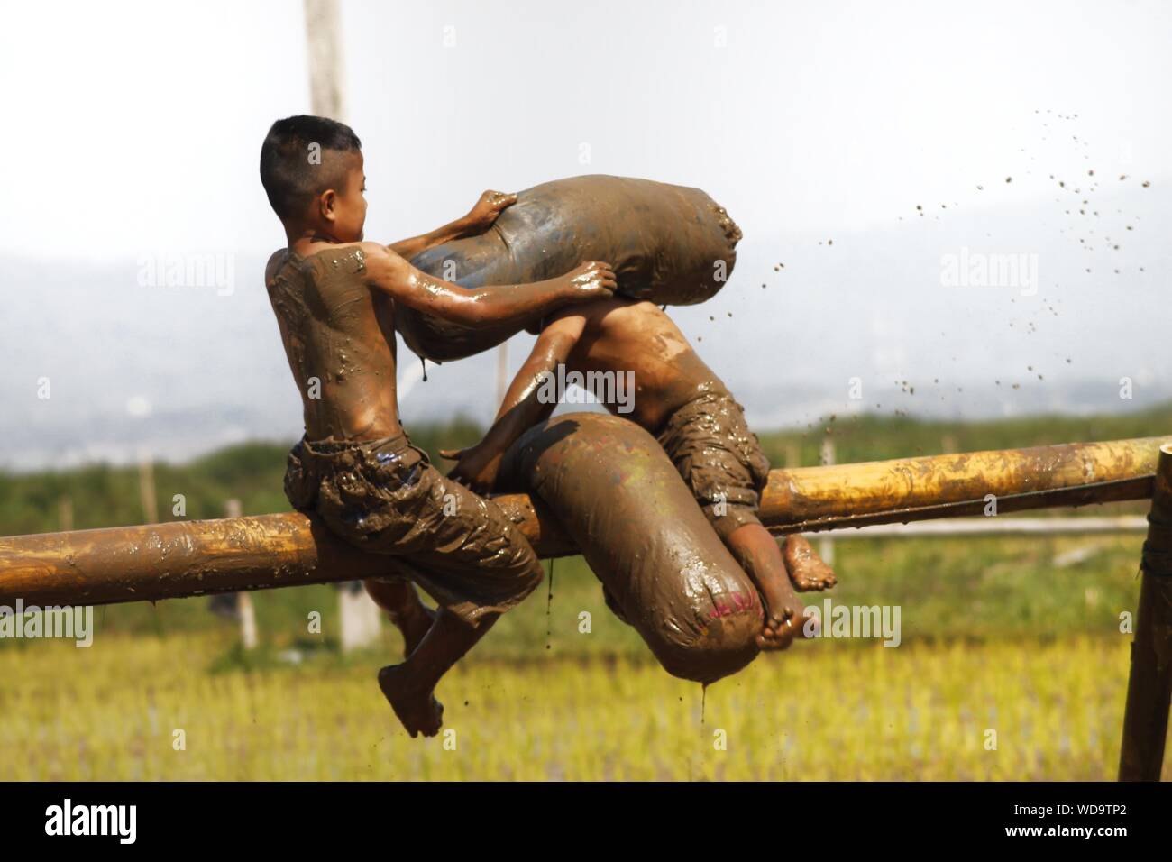 Messy Shirtless Boys Fighting While Sitting On Bamboo Against Sky Stock Photo Alamy Your alamy stock images are ready. https www alamy com messy shirtless boys fighting while sitting on bamboo against sky image266363050 html