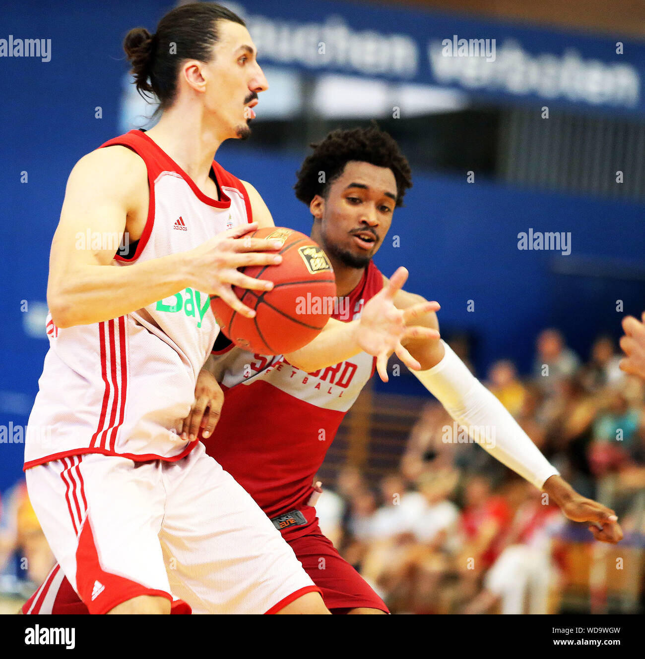 Rosenheim, Germnany. 27th Aug, 2019. from left Nihad DJEDOVIC  (Muenchen/BOS), Bryce WILLS (Stanford), .mens Basketball, pre season  friendly, Aug 27, 2019, FC Bayern Muenchen Basketball vs Stanford  University, Rosenheim, Gabor Hall, as
