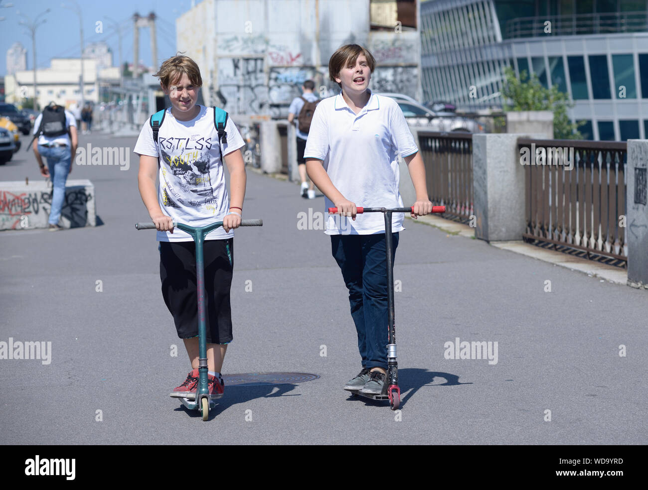 Two men scooters hires stock photography and images Alamy