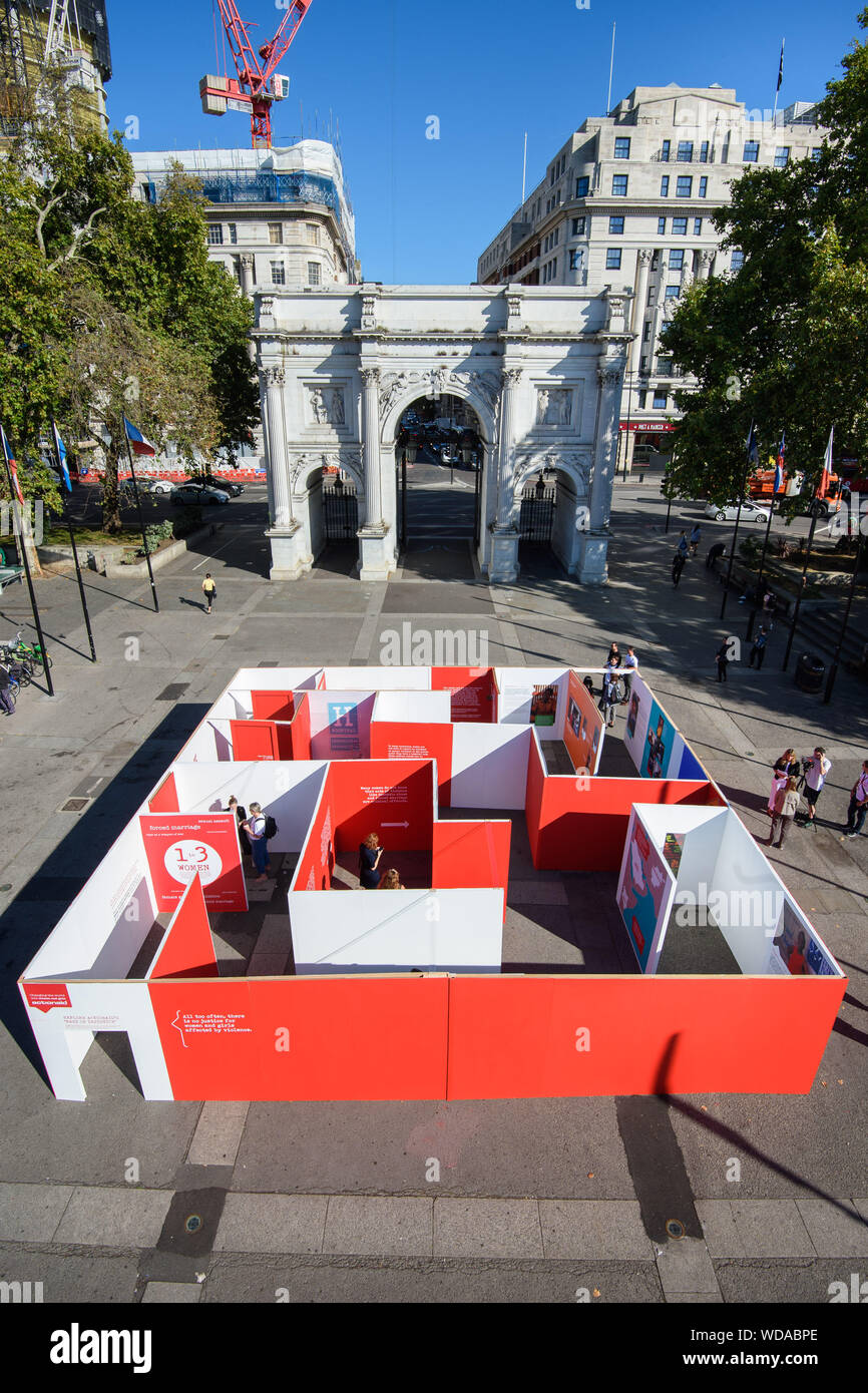 The ActionAid UK 'Maze of Injustice' in Marble Arch, London. The maze aims to engage the public in their campaign calling for better justice for women and girls who have survived violence. Stock Photo