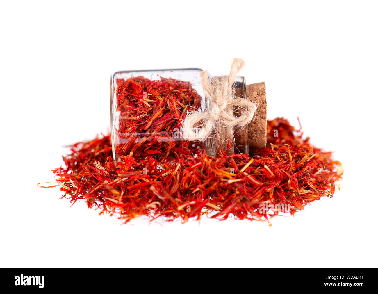 Pile of Saffron in glass jar, isolated on white background. Dried