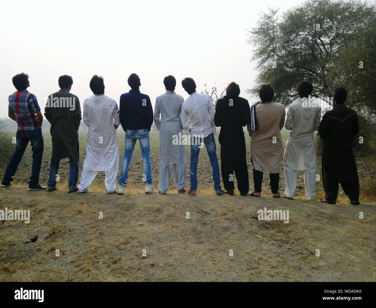 Rear view of group of men hi-res stock photography and images - Alamy