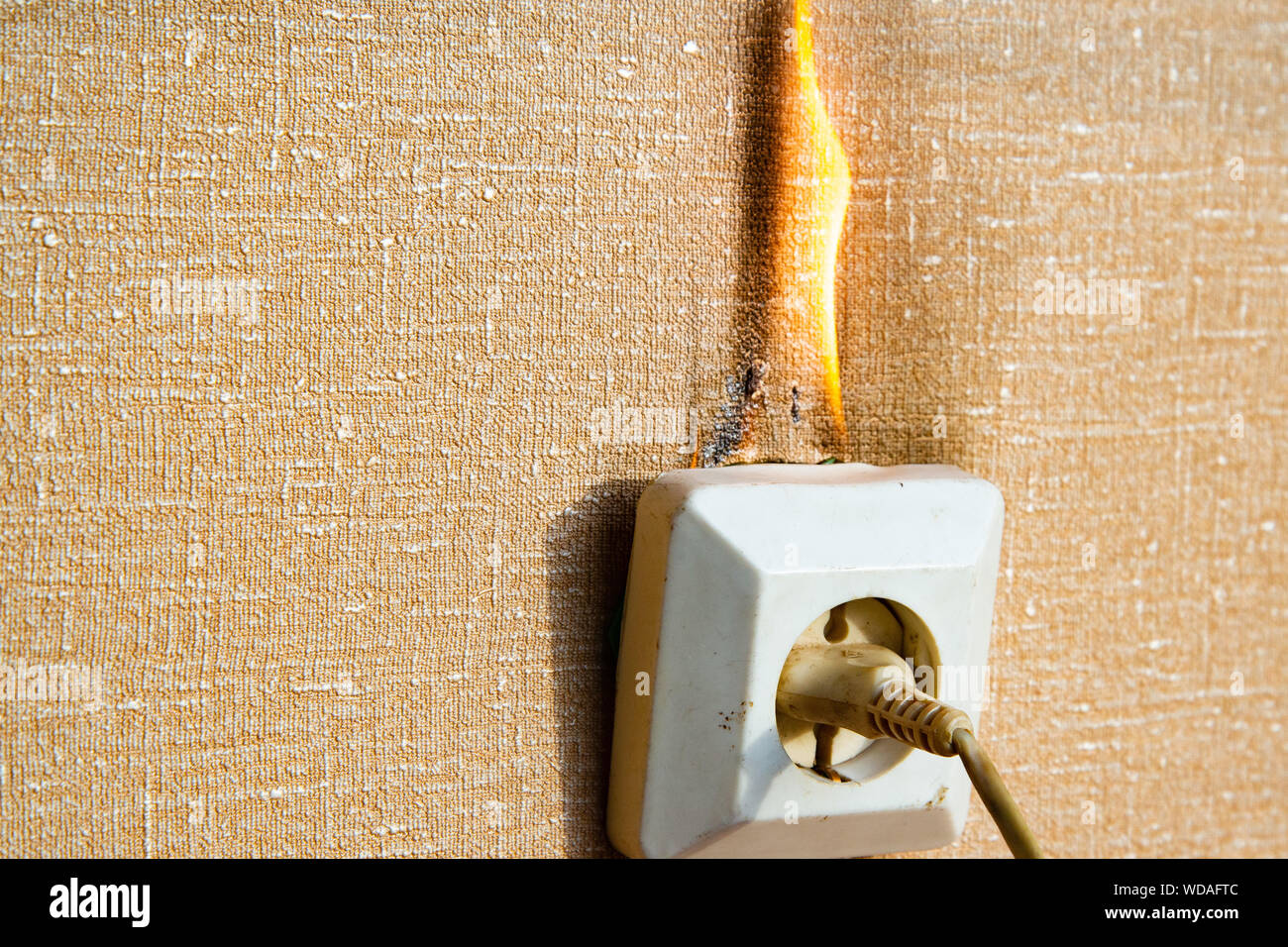 Burning electrical wiring and electrical outlet. Faulty wiring causes