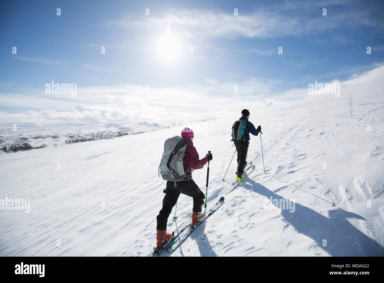 Two people cross country skiing Stock Photo