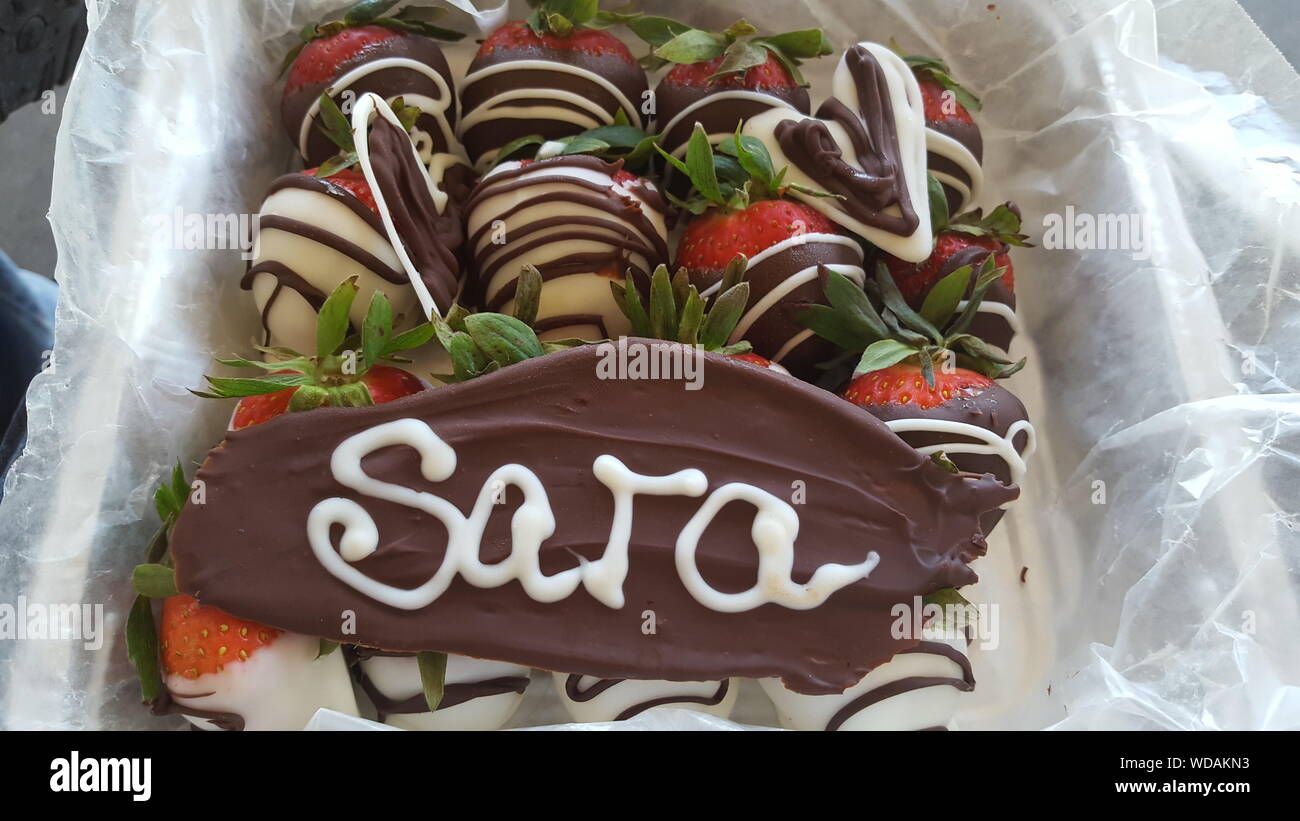 Close-up Of Chocolate Covered Strawberries With Text During Mother Day Stock Photo