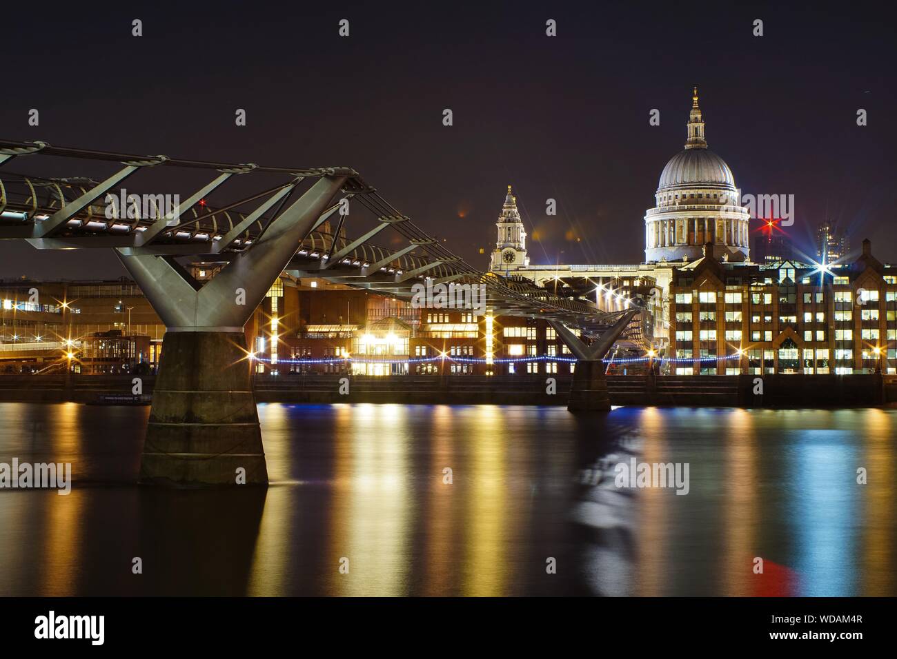 Millennium Footbridge By St Paul Cathedral At Night Stock Photo