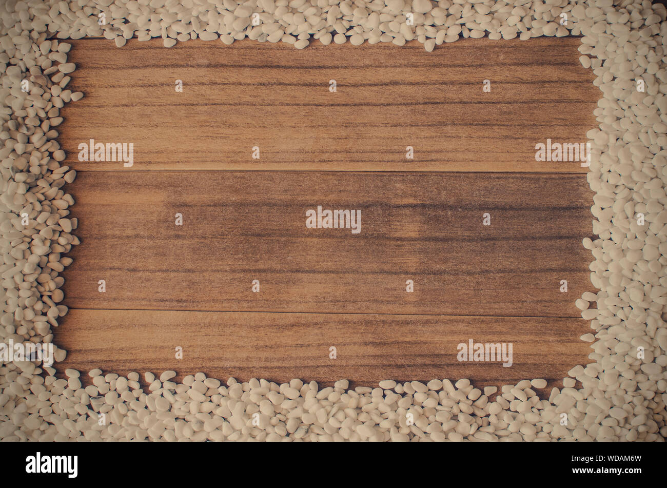 Frame Made With Small White Pebbles On A Wooden Background Copy