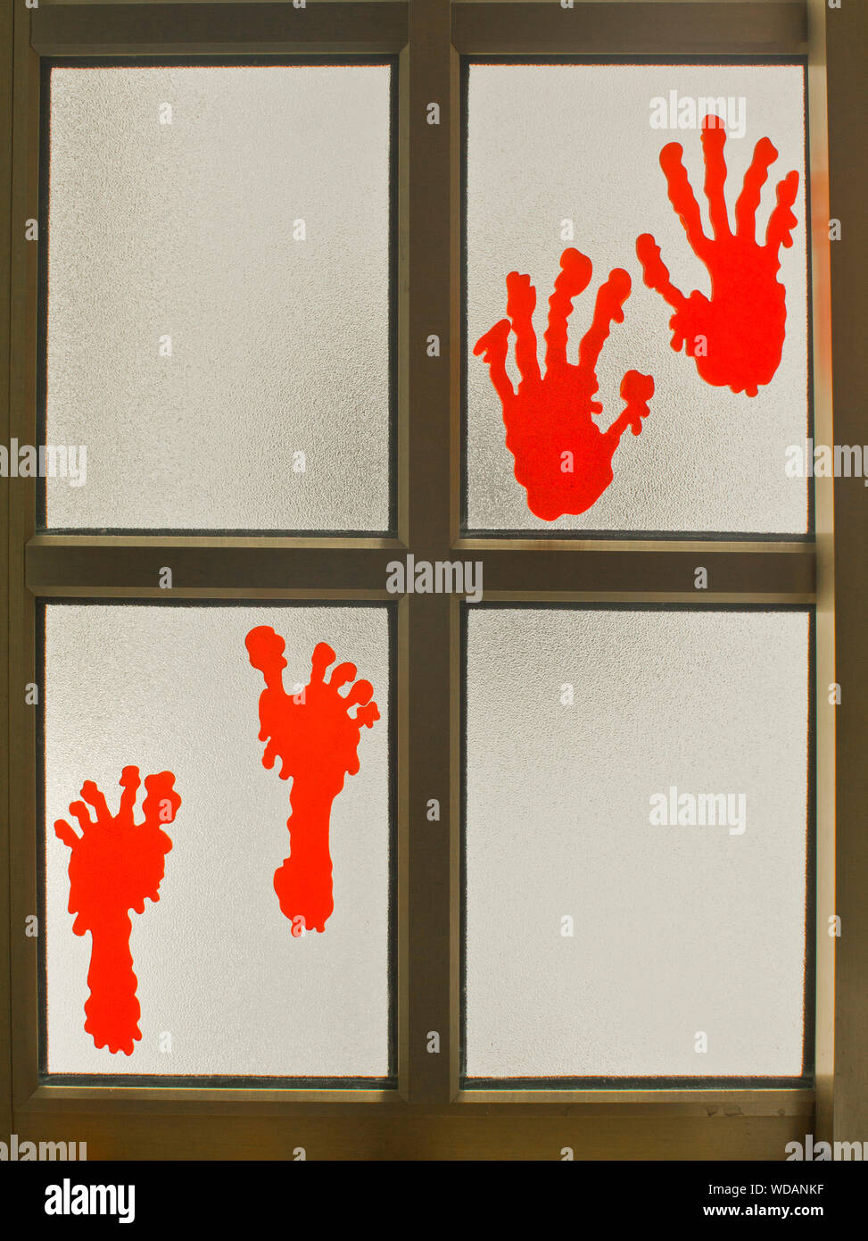 In Halloween Decoration Hands And Feet On A Kitchen Window Stock Photo Alamy
