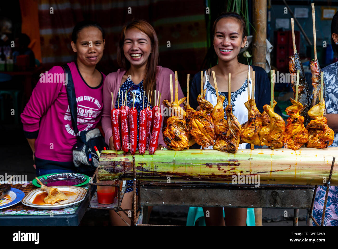 Young Filipinos Selling Street Food During The Dinagyang Festival