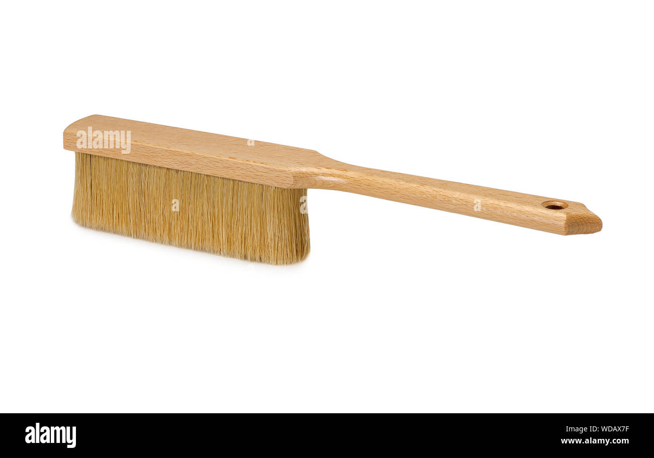 Bench brush with wooden handle isolated on white background. Dust brush or counter duster on white background Stock Photo