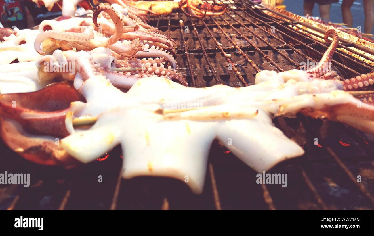 Octopus Cooking On Barbecue Stock Photo Alamy