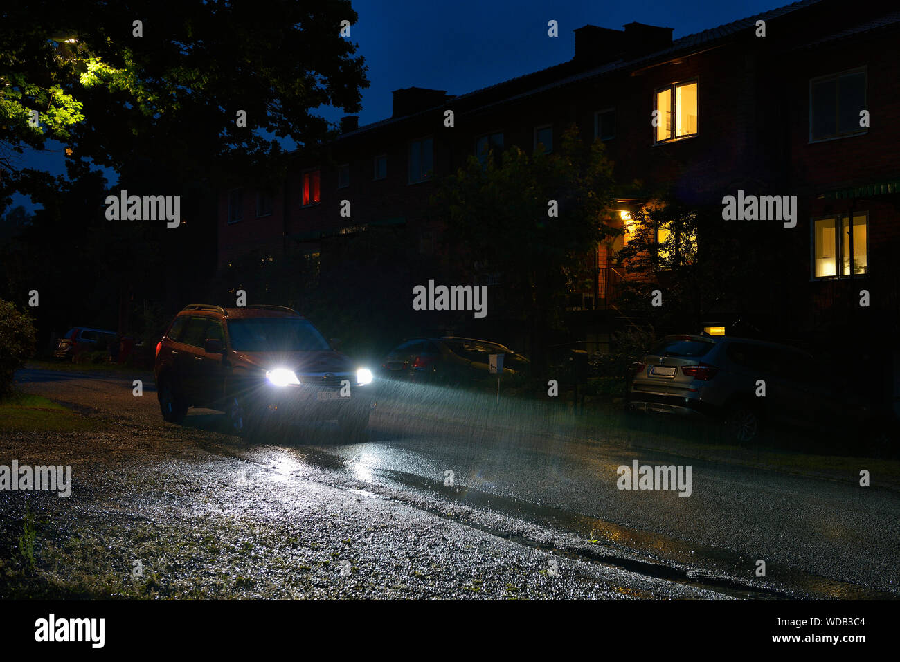 Car on street at rainy night Stock Photo