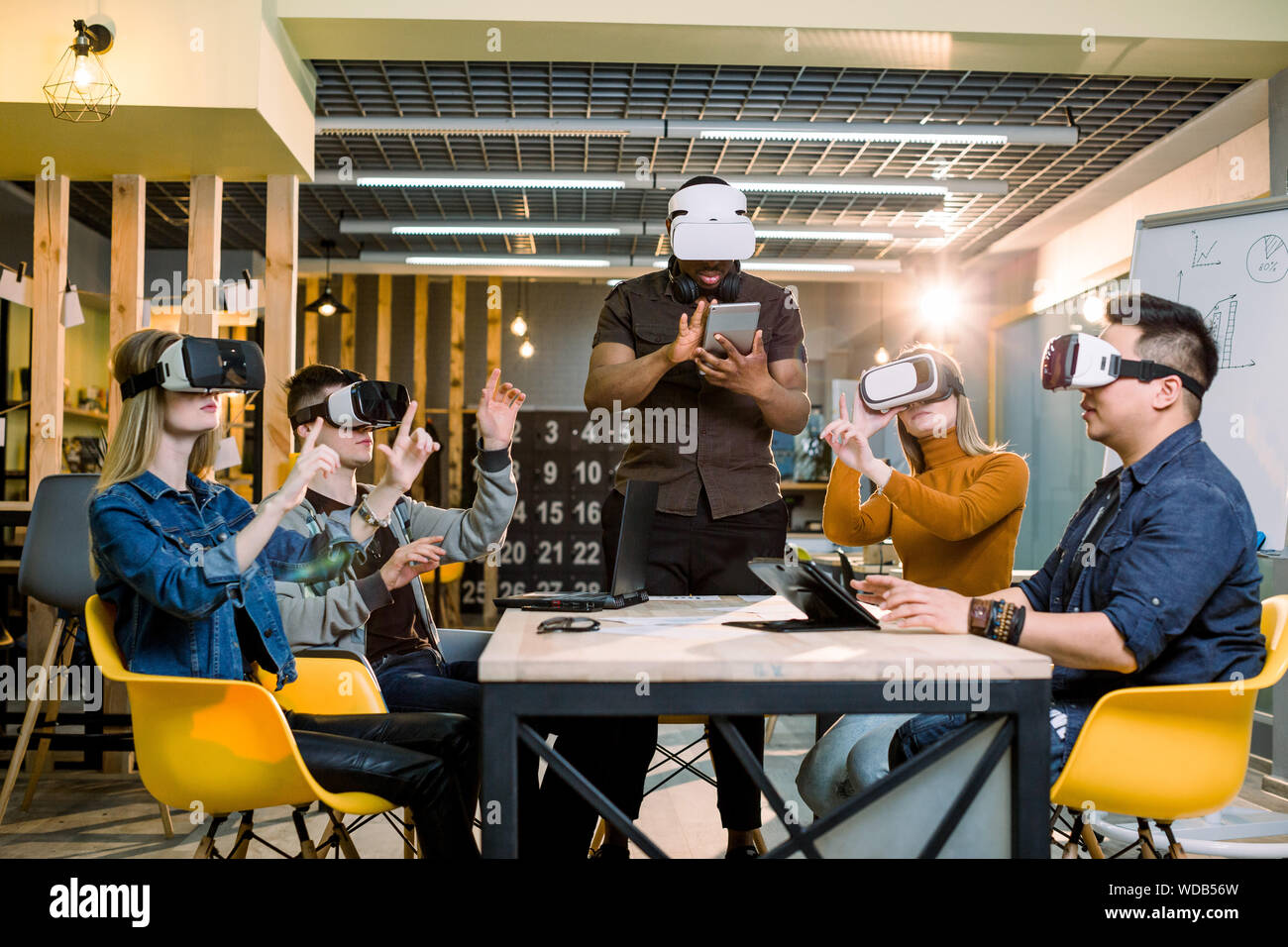 Meeting Simulation Multiethnic Business team using virtual reality headset in office ...