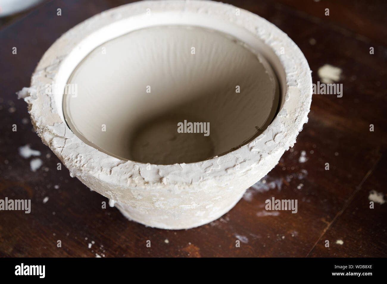 Mold for casting clay products with a finished bowl inside Stock Photo