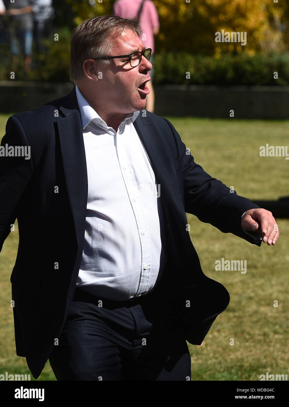 Conservative MP Mark Francois engages with protesters in Westminster, London. Stock Photo