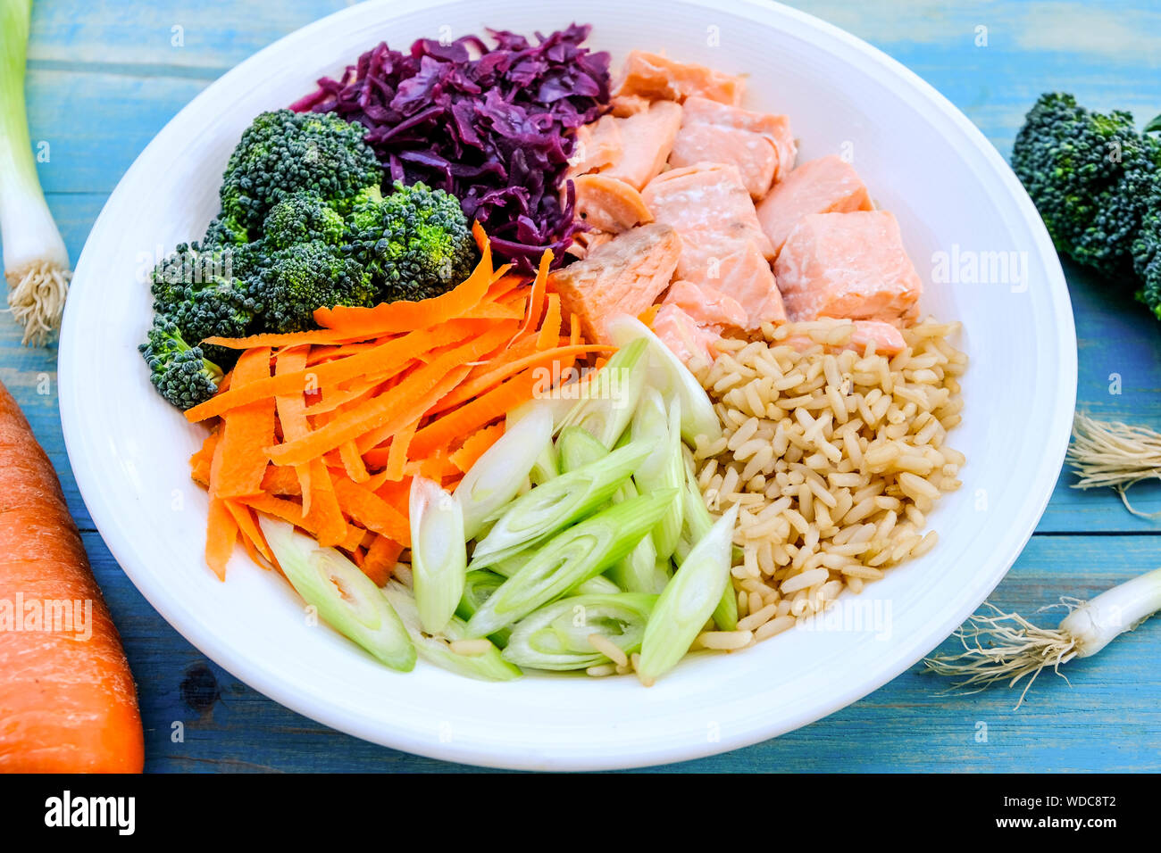 Fresh Healthy Salmon Poke Bowl With Broccoli, Carrots, Wholegrain Rice