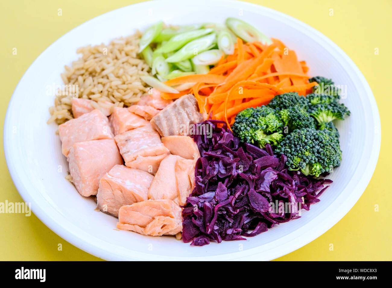 Fresh Healthy Salmon Poke Bowl With Broccoli, Carrots, Wholegrain Rice