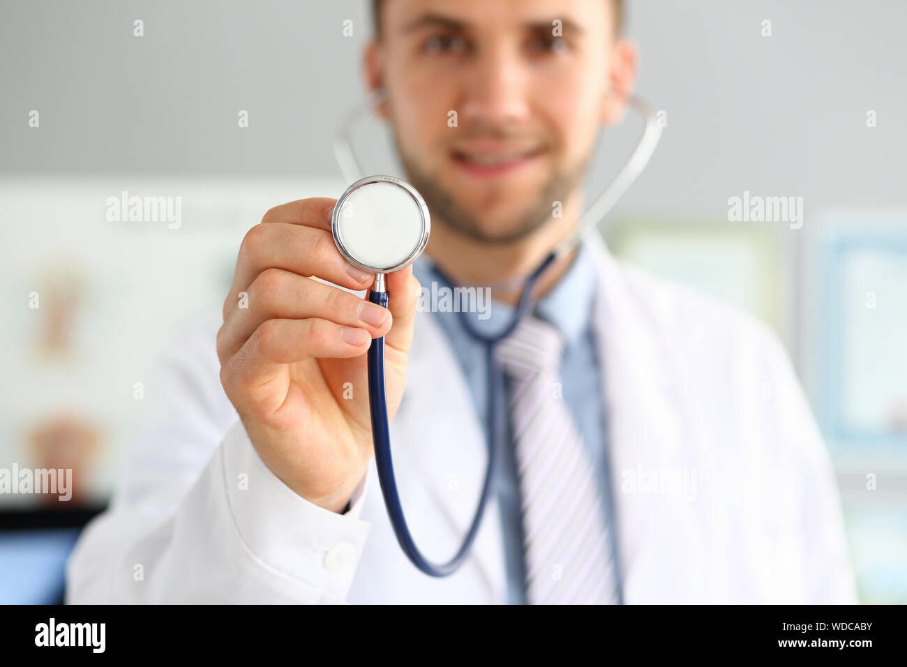 Physician with medical instrument Stock Photo - Alamy