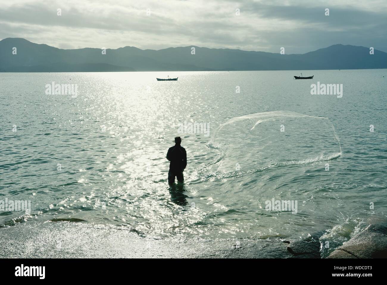 Standing fisherman hi-res stock photography and images - Alamy