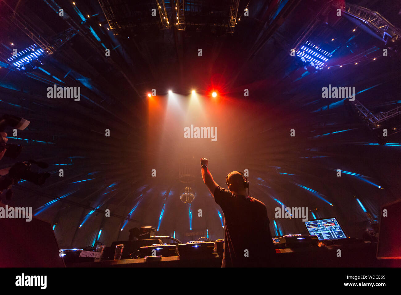 DJ with raised arm in in Amsterdam, Nederlands Stock Photo
