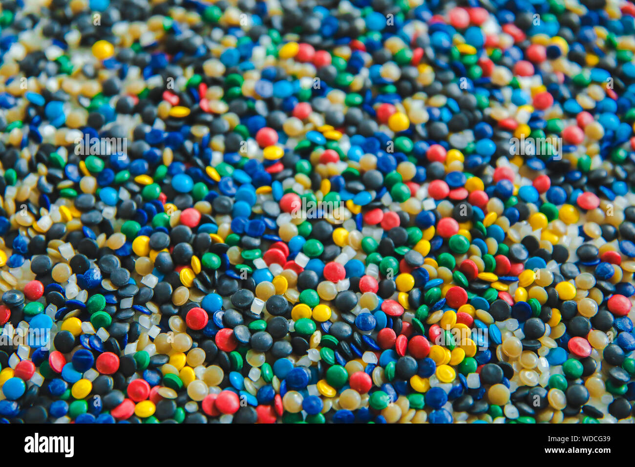 Polypropylene beads plastic pellets on black color background Stock Photo -  Alamy